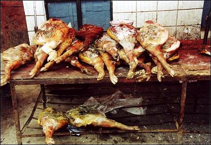China, Yunnan - Huize, pig feet in the market