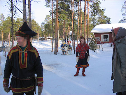 Finland, Lapland - Inhabitants reindeer farm in traditional Sami garb