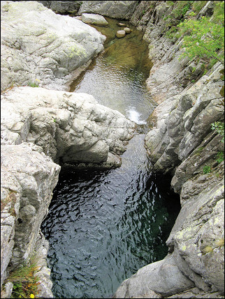France, Corsica - The Agnone brook meanders beautifully between the rocks