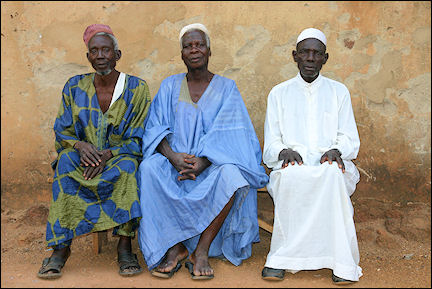 Ghana, Kadjebi-Nkwanta - Three men on a bench