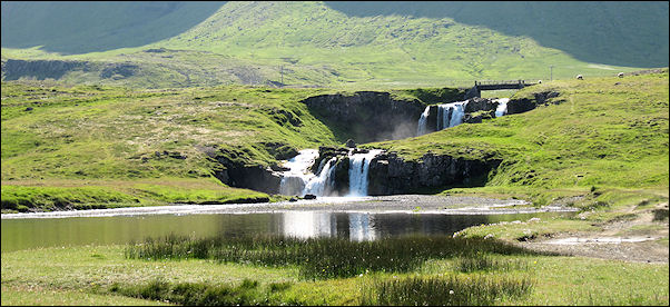 Iceland - Kirkjufellfoss in the shade of Mt. Kirkjufell