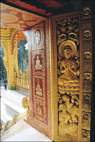 Laos - Richly decorated door in Luang Prabang