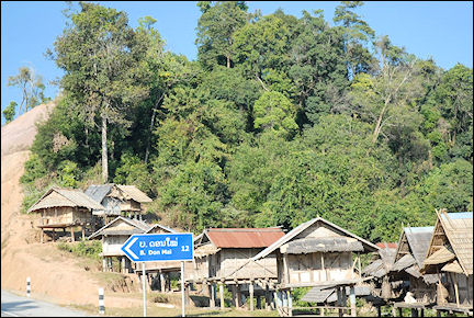Laos - Shabby bamboo huts on stilts in the northern part of Laos