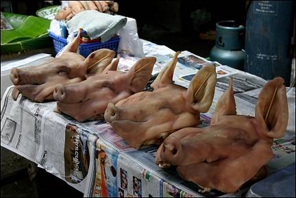 Thailand - Udon Thani, pigs' heads on the market