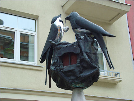 Lithuania, Siauliai - Birds over a bronze nest