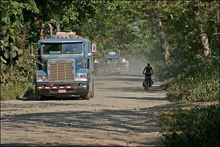 Panama - Dusty road with trucks