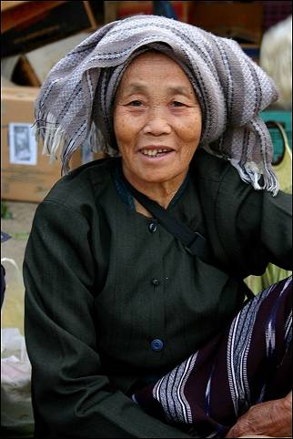 Thailand - Mae Sai, woman with head covering in market